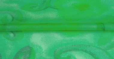 green fabric texture with abstract green print. luxury as abstract background. Luxury Christmas background. Fabric, delicate.