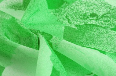 Abstract green silk chiffon fabric. Art mockup of spring green color taffeta silk fabric. Texture. background. template.