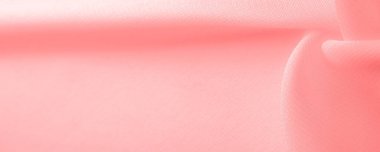 red pink silk fabric. a fine, strong, soft, lustrous fiber produced by silkworms in making cocoons and collected to make thread and fabric. Texture. Background.