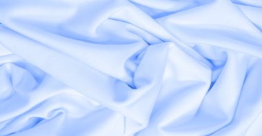 Beyaz ipek kumaş. Doku. Geçmişi. Şablon. Dupioni ipek kumaşının parlak bir parıltısı ve yatay hareket eden karakteristik küçük kıvrımları vardır. Yumuşak kıvrımlar içinde uzanır