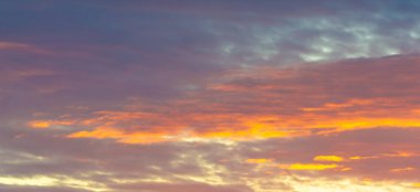 Dawn sunset. Beautiful cloud in pastel colors. Bluish yellow, sky ruby red paint on the sky. Texture. Background. Template. Panoramic photography