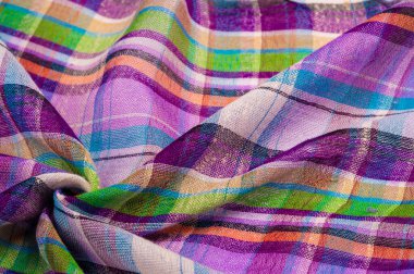 İskoç dokusunun arka plan dokusu, ki bu dokunun adı doğrudan ülkenin kökenini gösterir. Bu materyalin ikinci ve daha doğru adı tartan..