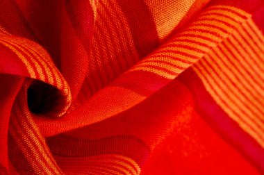 fabric red-burgundy, with a print of yellow lines. wine from Burgundy fabric color Texture. Background.