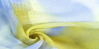 Yumuşak mavi, soyut desenleri ve yatak tonları olan ipek kumaş, sarı ve beyaz tonlarda. Doku, desen, koleksiyon