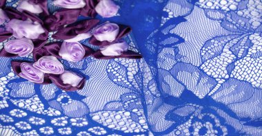 Blue lace with floral design. DIY crafts. Designer accessories. Decorations for your projects. Elastic finish. Texture background pattern