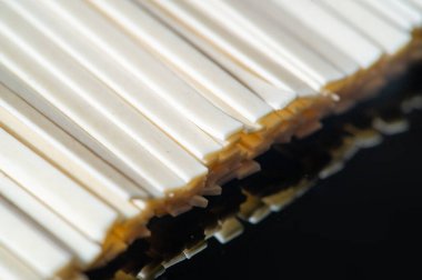 Linguine pasta. Linguini is usually made from both white flour and whole grains, but it was originally made from durum wheat. originated in Italy and is based on more traditional pastas.