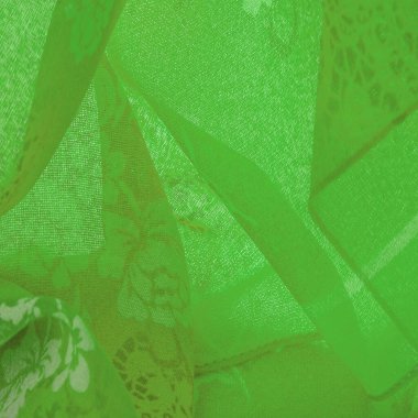 fabric, green silk with a floral pattern. Fragment of colorful retro silk textile pattern with floral ornament as background Texture, background, design,