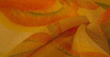 yellow fabric texture with abstract red print. luxury as abstract background. Luxury Christmas background. Fabric, delicate. Smooth elegant