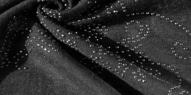 Yapışkan cam taşlı siyah ipek. doku arkaplanı, kartpostal deseni,