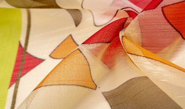 red, white and yellow geometric colors, made of fine viscose silk. organza pattern. Texture. Background fine knitted fabric - light transparent,