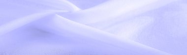 pale blue silk fabric. thin, strong, soft, shiny fiber produced by silkworms. the feel, appearance, or consistency of a surface or a substance. Texture. Background.