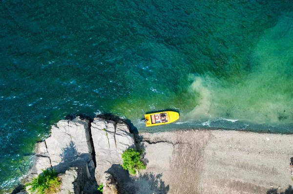 Aerial view from a drone on a beach and a boat, on the coast of the Dniester river, in Ukraine, Bakota