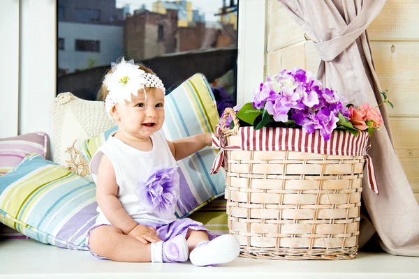 Little baby girl in hat with flower — Stock Photo, Image