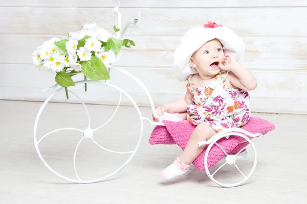 Little baby girl in hat with flower — Stock Photo, Image