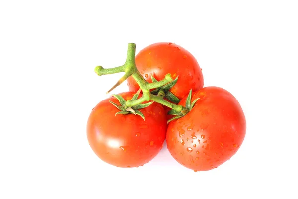 A brush of large tomatoes on a white background. Studio photo, isolate, tomatoes, washed.