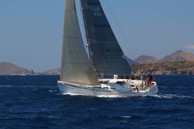 Bodrum,Turkey. 25 May 2019: Sailboats sail in windy weather in the blue waters of the Aegean Sea, on the shores of the famous holiday destination Bodrum.