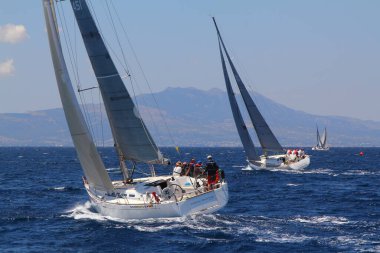 Bodrum,Turkey. 25 May 2019: Sailboats sail in windy weather in the blue waters of the Aegean Sea, on the shores of the famous holiday destination Bodrum.