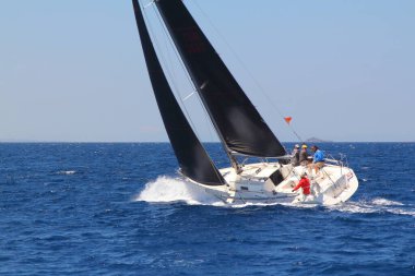 Bodrum,Turkey. 25 May 2019: Sailboats sail in windy weather in the blue waters of the Aegean Sea, on the shores of the famous holiday destination Bodrum.