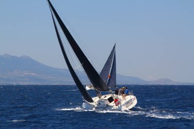 Bodrum,Turkey. 25 May 2019: Sailboats sail in windy weather in the blue waters of the Aegean Sea, on the shores of the famous holiday destination Bodrum.