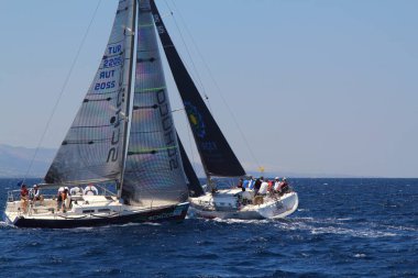 Bodrum,Turkey. 25 May 2019: Sailboats sail in windy weather in the blue waters of the Aegean Sea, on the shores of the famous holiday destination Bodrum.