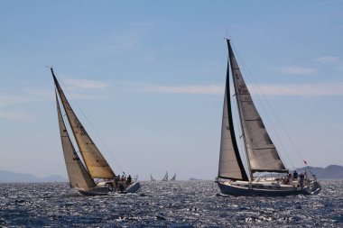 Bodrum,Turkey. 25 May 2019: Sailboats sail in windy weather in the blue waters of the Aegean Sea, on the shores of the famous holiday destination Bodrum.