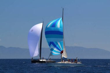 Bodrum,Turkey. 25 May 2019: Sailboats sail in windy weather in the blue waters of the Aegean Sea, on the shores of the famous holiday destination Bodrum.