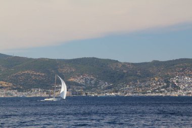 Bodrum,Turkey. 25 May 2019: Sailboats sail in windy weather in the blue waters of the Aegean Sea, on the shores of the famous holiday destination Bodrum.