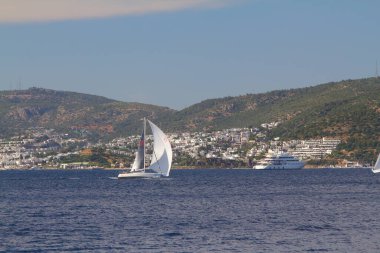 Bodrum,Turkey. 25 May 2019: Sailboats sail in windy weather in the blue waters of the Aegean Sea, on the shores of the famous holiday destination Bodrum.