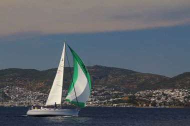 Bodrum,Turkey. 25 May 2019: Sailboats sail in windy weather in the blue waters of the Aegean Sea, on the shores of the famous holiday destination Bodrum.
