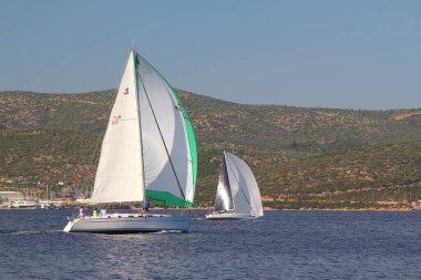 Bodrum,Turkey. 25 May 2019: Sailboats sail in windy weather in the blue waters of the Aegean Sea, on the shores of the famous holiday destination Bodrum.