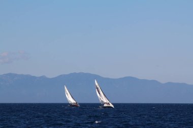 Bodrum,Turkey. 25 May 2019: Sailboats sail in windy weather in the blue waters of the Aegean Sea, on the shores of the famous holiday destination Bodrum.