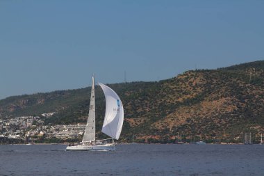 Bodrum,Turkey. 25 May 2019: Sailboats sail in windy weather in the blue waters of the Aegean Sea, on the shores of the famous holiday destination Bodrum.