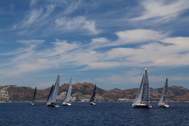 Bodrum,Turkey. 26 May 2019: Sailboats sail in windy weather in the blue waters of the Aegean Sea, on the shores of the famous holiday destination Bodrum.