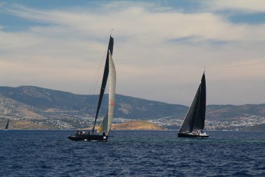 Bodrum,Turkey. 26 May 2019: Sailboats sail in windy weather in the blue waters of the Aegean Sea, on the shores of the famous holiday destination Bodrum.
