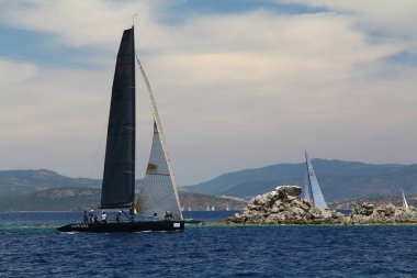 Bodrum,Turkey. 26 May 2019: Sailboats sail in windy weather in the blue waters of the Aegean Sea, on the shores of the famous holiday destination Bodrum.