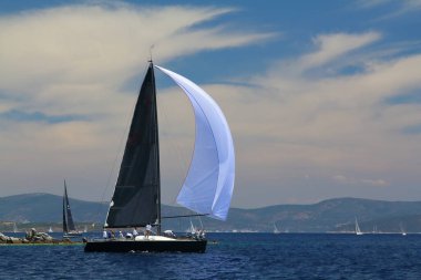 Bodrum,Turkey. 26 May 2019: Sailboats sail in windy weather in the blue waters of the Aegean Sea, on the shores of the famous holiday destination Bodrum.