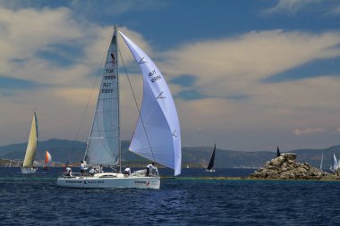 Bodrum,Turkey. 26 May 2019: Sailboats sail in windy weather in the blue waters of the Aegean Sea, on the shores of the famous holiday destination Bodrum.
