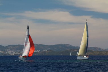 Bodrum,Turkey. 26 May 2019: Sailboats sail in windy weather in the blue waters of the Aegean Sea, on the shores of the famous holiday destination Bodrum.