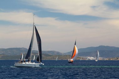 Bodrum,Turkey. 26 May 2019: Sailboats sail in windy weather in the blue waters of the Aegean Sea, on the shores of the famous holiday destination Bodrum.