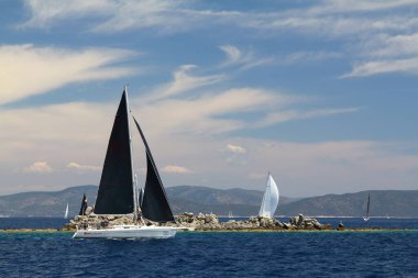 Bodrum,Turkey. 26 May 2019: Sailboats sail in windy weather in the blue waters of the Aegean Sea, on the shores of the famous holiday destination Bodrum.
