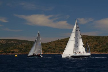 Bodrum,Turkey. 26 May 2019: Sailboats sail in windy weather in the blue waters of the Aegean Sea, on the shores of the famous holiday destination Bodrum.
