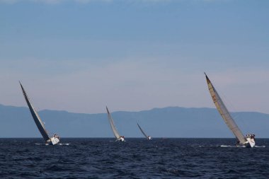 Bodrum,Turkey. 26 May 2019: Sailboats sail in windy weather in the blue waters of the Aegean Sea, on the shores of the famous holiday destination Bodrum.