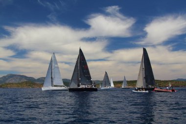 Bodrum,Turkey. 26 May 2019: Sailboats sail in windy weather in the blue waters of the Aegean Sea, on the shores of the famous holiday destination Bodrum.