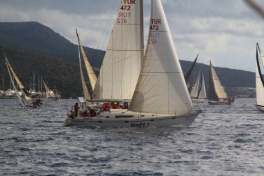 Bodrum,Turkey. 19 January 2019: Sailboats sail in windy weather in the blue waters of the Aegean Sea, on the shores of the famous holiday destination Bodrum.