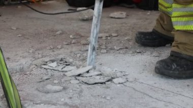 Debris study in earthquake drill. The building base is drilled with special drills. Emergency action to save lives.