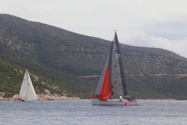 Bodrum,Turkey. 19 January 2019: Sailboats sail in windy weather in the blue waters of the Aegean Sea, on the shores of the famous holiday destination Bodrum.