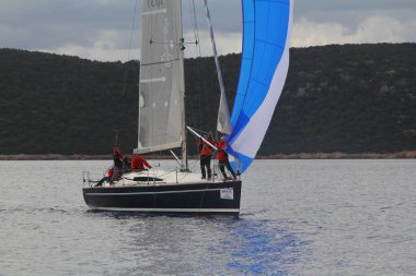 Bodrum,Turkey. 19 January 2019: Sailboats sail in windy weather in the blue waters of the Aegean Sea, on the shores of the famous holiday destination Bodrum.
