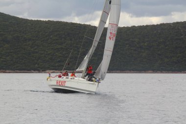Bodrum,Turkey. 19 January 2019: Sailboats sail in windy weather in the blue waters of the Aegean Sea, on the shores of the famous holiday destination Bodrum.