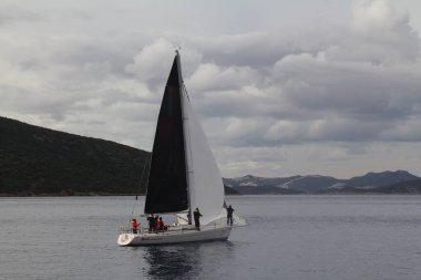 Bodrum,Turkey. 19 January 2019: Sailboats sail in windy weather in the blue waters of the Aegean Sea, on the shores of the famous holiday destination Bodrum.