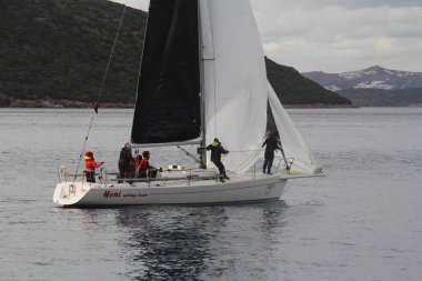 Bodrum,Turkey. 19 January 2019: Sailboats sail in windy weather in the blue waters of the Aegean Sea, on the shores of the famous holiday destination Bodrum.